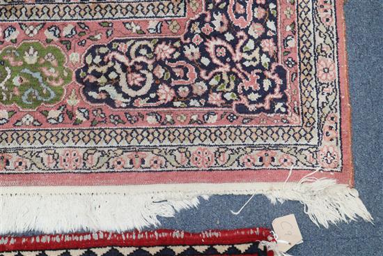 A Persian pattern rose ground cotton and silk rug 298 x 215cm